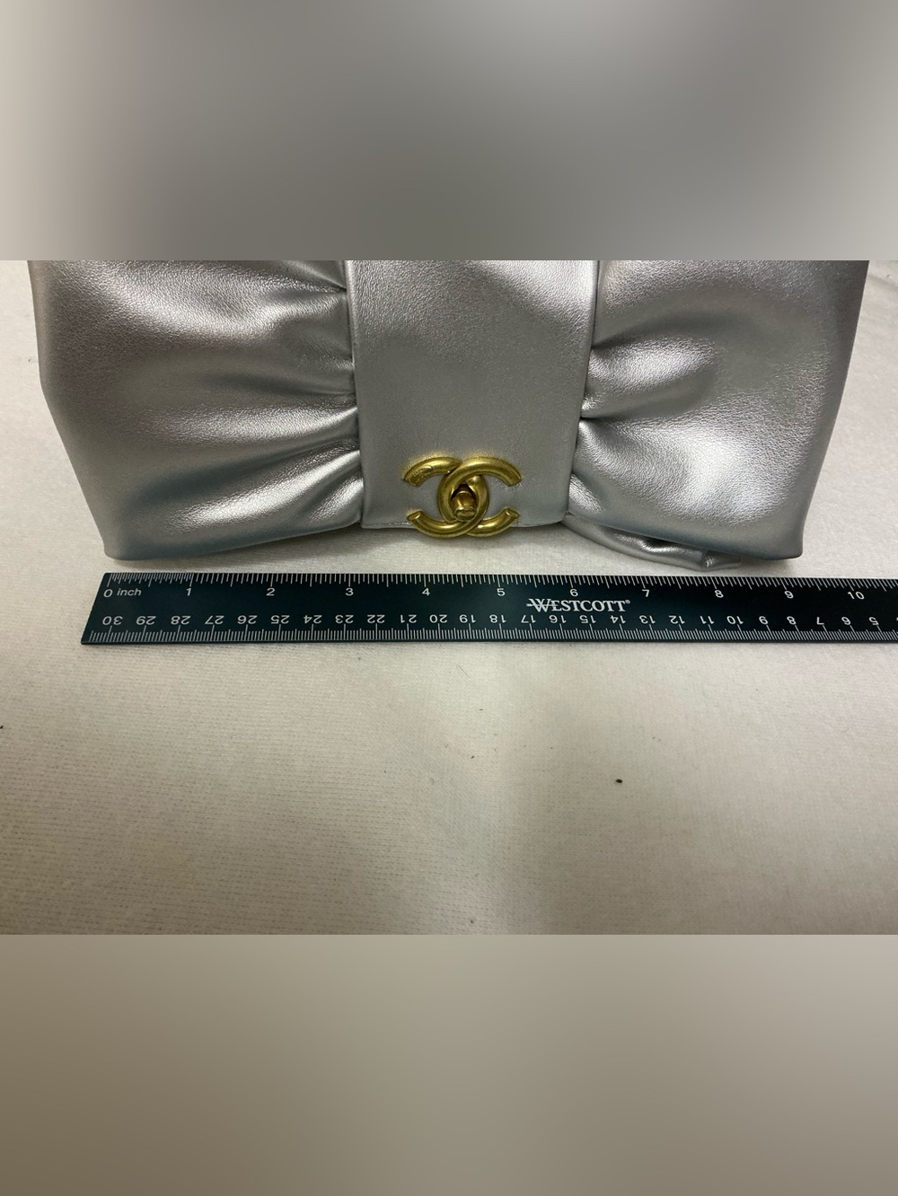 Silver Satin Bow Clutch with Gold Emblem